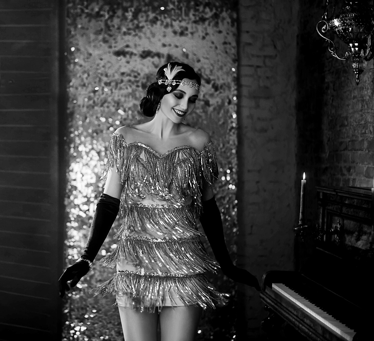 Young happy flapper beautiful woman. Black and white photo. Style roar Party 20s